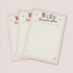 May include: Three identical rectangular paper planners with a light pink border and a cream-coloured centre. The text reads MAIN Character plans FOR DAYS THAT GIVE MAIN CHARACTER ENERGY and LITERARY CRAFT PARLOUR, decorated with teal starbursts.