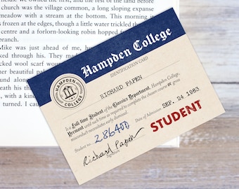 May include: A vintage-style student identification card for Hampden College. The card is cream-colored with red and black text. The card includes the student's name, Richard Papen, student number 2.86400, and date of admission September 24, 1983. The card also features a seal with the college's name and a depiction of three buildings.