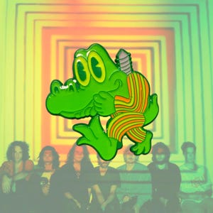 May include: A green enamel pin featuring a cartoon alligator with large yellow eyes and orange striped clothing. The alligator is depicted in a dynamic pose with its arms crossed, showcasing a vibrant color palette and smooth finish.