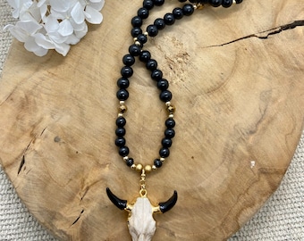 Sautoir en strass et bois noir pendentif tête de buffle doré