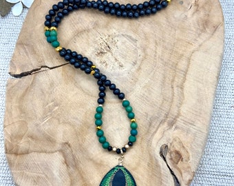 boho chic wooden long necklace with green pendant with pompoms