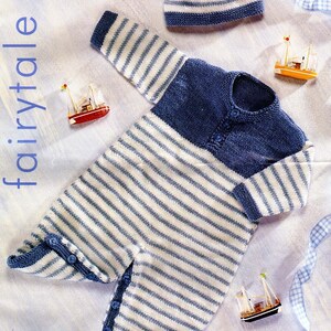 May include: A blue and white striped knitted baby onesie with a matching blue and white striped hat. The onesie has a blue bodice and white striped legs. The hat has a small tassel. PBN D 2457 41-56 cm 16-22 inches age range 0-3yrs