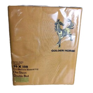 May include: A packaged, tan-coloured double bed sheet. The packaging features a graphic of a horse and the text "GOLDEN HORSE". The sheet measures 228.6 x 274.3 cm before hemming. The packaging also states "Superior Quality and Colourfast Guaranteed".