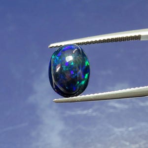 AAA Black Opal Cabochon: Welo Ethiopian Gemstone, 11x9x5mm