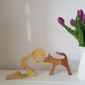 Man with small dog wooden figures, sculpture for decoration for dog lovers, spruce and oak, different variants possible.