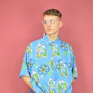 Camisa multicolor con gráfico del festival hawaiano vintage {K56}