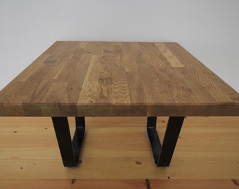 Oak coffee table with black trapezium legs