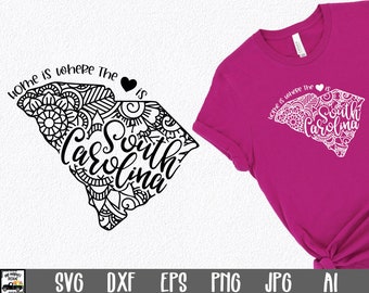 May include: Black and white graphic design of the state of South Carolina with the text "Home is where the South Carolina is" and a heart. The design is perfect for a t-shirt, tote bag, or other craft project.