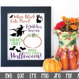 May include: A black framed printable sign with a Halloween countdown design. The sign features a black cat, a witch flying on a broomstick, and a pumpkin with a blank space for writing in the number of days until Halloween. The text on the sign reads "When Black Cats Prowl & Witches Scream There's Only Days Left Until Halloween!"