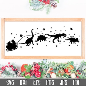May include: Black and white silhouette of a dinosaur pulling a sleigh with Santa Claus. The dinosaurs are a stegosaurus, a brachiosaurus, a tyrannosaurus rex, and a triceratops. The image is set against a white background with stars.