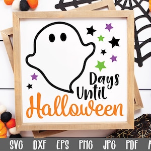 May include: A wooden sign with a white background and a black ghost illustration. The sign says "Days Until Halloween" in black and orange text with purple and black stars around the ghost.