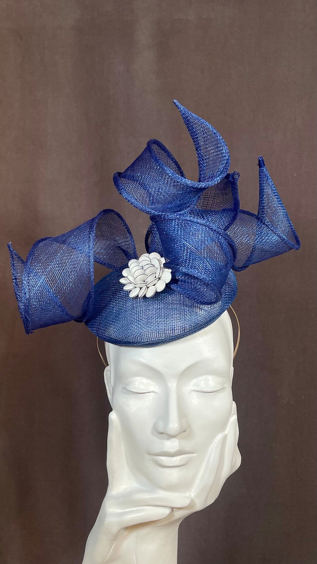 Blue Curly Sinamay Fascinator With White Buttoned Detail. A Fun and ...