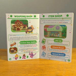 May include: Two open pages from a game guide book. The left page shows a green building with a brown roof and a sign that says "Weapons Shop". The right page shows a green building with a brown roof and a sign that says "Item Shop". The text on the pages describes the different items and abilities available in the game.