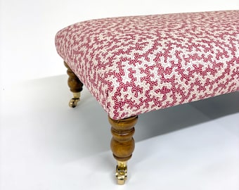 Large upholstered Footstool in red and white fabric coffee table in patterned fabric large footstool. Large red ottoman on castor legs