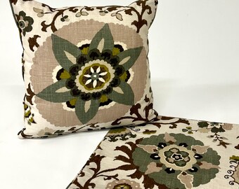 Scatter cushion in Sanderson modern floral design, green leaves on an ivory natural fabric. Self piping matches enhances the look.