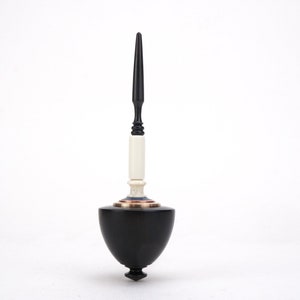Wind-up spinning top
