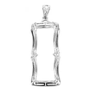 May include: Silver pendant with a rectangular frame and small clear stones. The frame is open and ready to hold a photo or other memento.