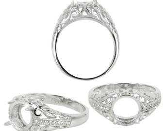 May include: A silver ring setting with an ornate filigree design. The ring features a square setting for a gemstone and is accented with small, sparkling stones. The ring is shown from multiple angles, highlighting its intricate details and craftsmanship.