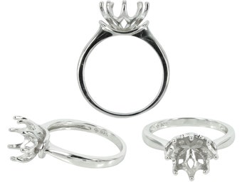 Puede incluir: Un engaste de anillo de plata con una cabeza de seis garras, diseñado para sujetar una piedra central. El anillo se muestra desde tres ángulos diferentes.