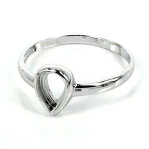 May include: A silver ring with a teardrop-shaped cutout. The ring is simple and elegant.