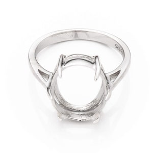 May include: Silver ring setting with a round bezel for a gemstone. The ring is marked "S925" on the inside band.