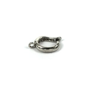 May include: Silver-toned metal clasp with a textured finish and a loop for attaching to a necklace or bracelet.