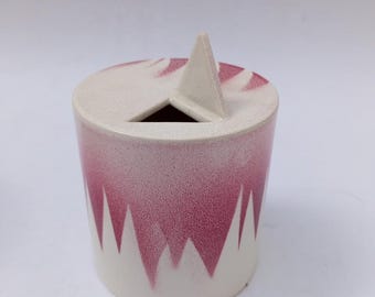 Detail of a Sangiorgi Faenza ceramic vase with a single-flower, vintage, futuristic geometric decoration.
