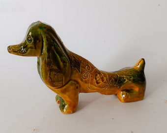 Bitossi cerámica diseño de perro salchicha Aldo Londi vintage era espacial figura verde amarillo