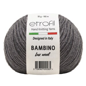 May include: A skein of gray yarn labeled "etrofil" with the text "Hand Knitting Yarns", "Designed in Italy", "BAMBINO", and "Lux wool". The label also includes a barcode and the text "50 g - 160 m".