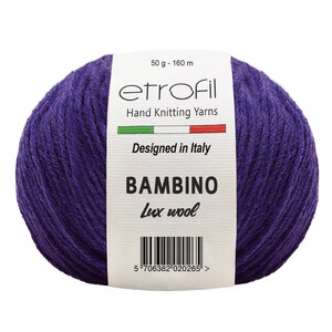 May include: A skein of purple yarn labeled "etrofil" Hand Knitting Yarns, "Designed in Italy", "BAMBINO Lux wool", and a barcode. The skein is 50 grams and 160 meters.