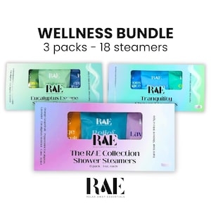 May include: Wellness bundle of shower steamers. The image shows three boxes of RAE shower steamers. The boxes are white with colorful accents and contain individual steamers in various colors. The text on the boxes reads "Eucalyptus Escape", "Tranquility", and "The RAE Collection".