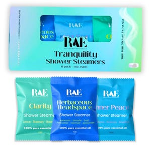 May include: A box set of RAE Tranquility Shower Steamers, featuring six 1-oz packs. The box is white with a blue and green gradient. Individual packs are teal, blue, and light blue, each labeled with a different scent and the words "Shower Steamer."
