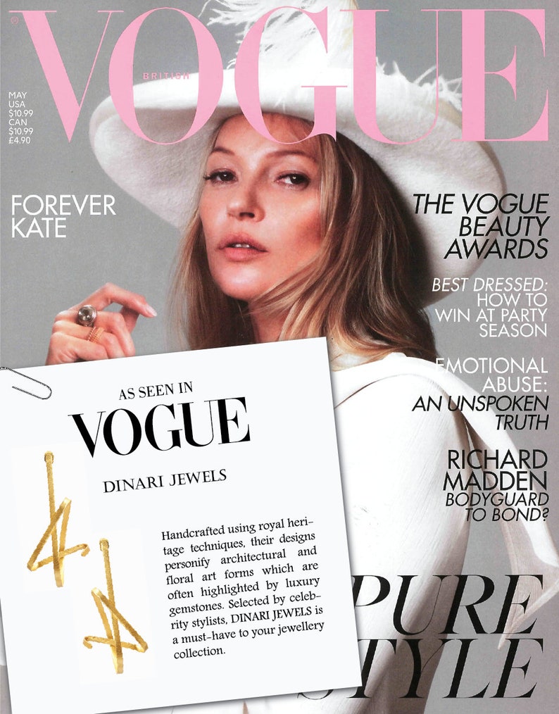 May include: A magazine cover featuring a woman wearing a white hat with a feather. The magazine is titled "Vogue" and features the text "The Vogue Beauty Awards" and "Best Dressed: How to Win at Party Season".