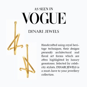 May include: Gold earrings with a unique, abstract design. The earrings are handcrafted and feature a textured finish. As seen in Vogue, Dinari Jewels.