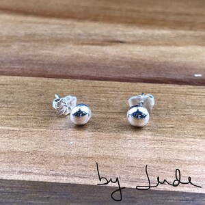Sterling silver stud earrings with sterling silver pushback.