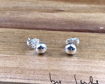 Sterling silver stud earrings with sterling silver pushback.