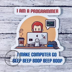 May include: A white sticker with a cartoon illustration of a person with a red beard sitting at a computer. The text "I AM A PROGRAMMER" is at the top of the sticker. The text "MAKE COMPUTER GO BEEP BEEP BOOP BEEP BOOP" is at the bottom of the sticker.