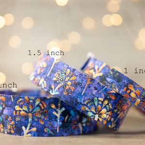 May include: Three colourful patterned fabric wristbands in blue, orange and yellow. The wristbands are 1 inch, 1.5 inches and 2 inches wide.
