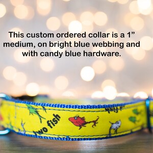 May include: A yellow dog collar with a blue border and a "Two Fish" print. The collar is 1 inch wide and has bright blue webbing and candy blue hardware.