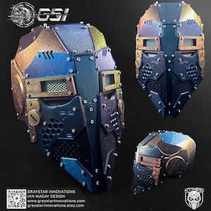 May include: A futuristic, multi-piece mask in shades of blue, bronze, and purple. The mask features a complex design with geometric shapes, rivets, and mesh detailing. The image includes the text "GRAYSTAR INNOVATIONS" and "ANTIHERO".