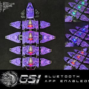 May include: A purple and black segmented body armour with multiple LED lights. The armour is connected by wires and has a GSI Bluetooth App Enabled! logo at the bottom.