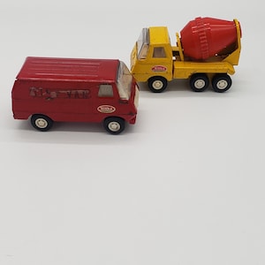May include: Two Tonka toy trucks, a red delivery van and a yellow cement mixer. Both trucks have the Tonka logo on the side.