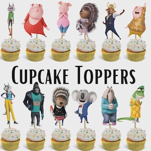 May include: Cupcake toppers featuring characters from the animated movie "Sing". Each cupcake has white frosting with colorful sprinkles. The toppers depict various animal characters in vibrant outfits. The text "Cupcake Toppers" is displayed in large, black letters.