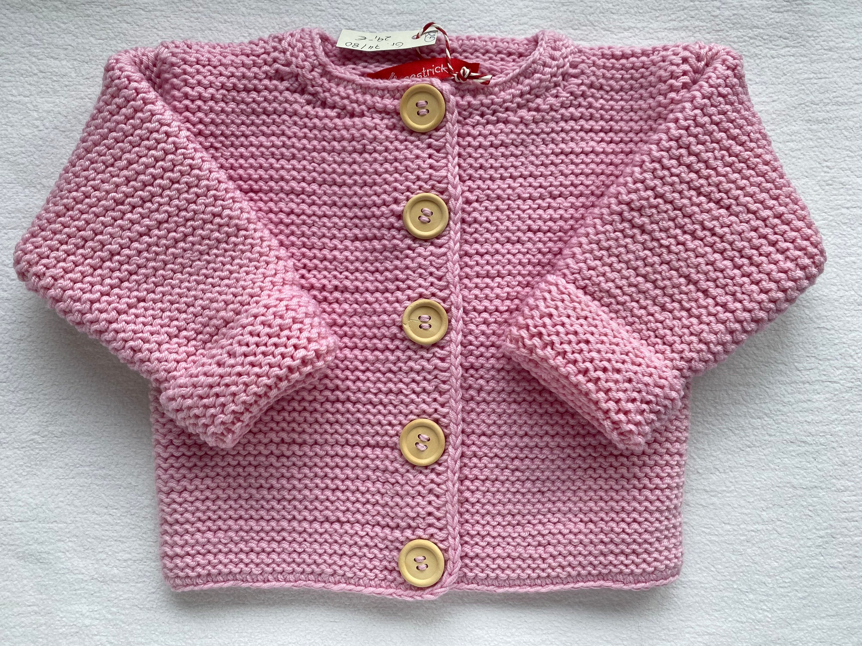 Babyjacke in rosa aus reiner Merinowolle kraus rechts