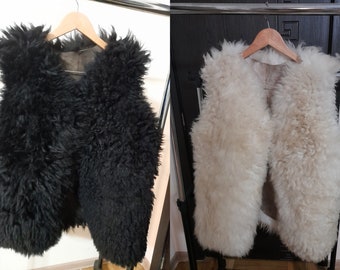 Lot of 2. natural sheep vest.  Black  and  white.