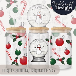 May include: Three clear glass tumblers with wooden lids and straws. Each tumbler has a different design featuring a snowman in a snow globe with the text "Let it Snow". The background of each tumbler is a white pattern with red and green ornaments, holly, and candy canes.