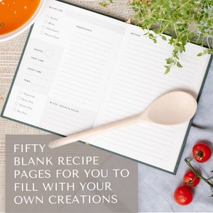 May include: An open blank recipe book with a wooden spoon, tomatoes, and a sprig of thyme. The book has lines for writing down ingredients, instructions, and tips. The text on the book reads "Fifty Blank Recipe Pages for You to Fill with Your Own Creations".