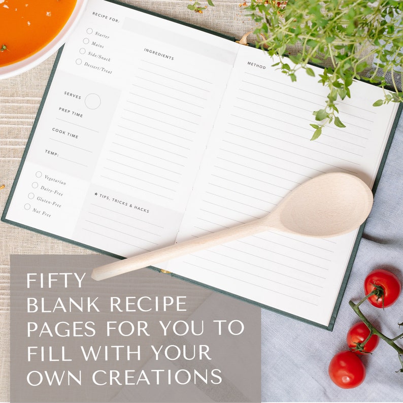 May include: An open blank recipe book with a wooden spoon, tomatoes, and a sprig of thyme. The book has lines for writing down ingredients, instructions, and tips. The text on the book reads "Fifty Blank Recipe Pages for You to Fill with Your Own Creations".