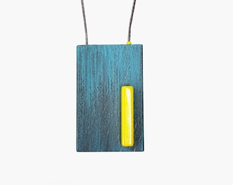 Hand painted colorful wooden pendant necklace in gray and petrol with yellow details.
