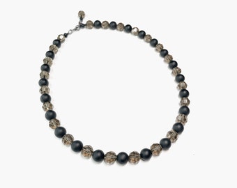 Natural faceted smokey quartz and matte black onyx beaded necklace with sterling silver closure.